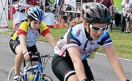 Glennie Heights State School student Elsie van Hoof (middle) on the way to three state cycling gold medals. Glennie Heights State School student Elsie van Hoof (middle) on the way to three state cycling gold medals.